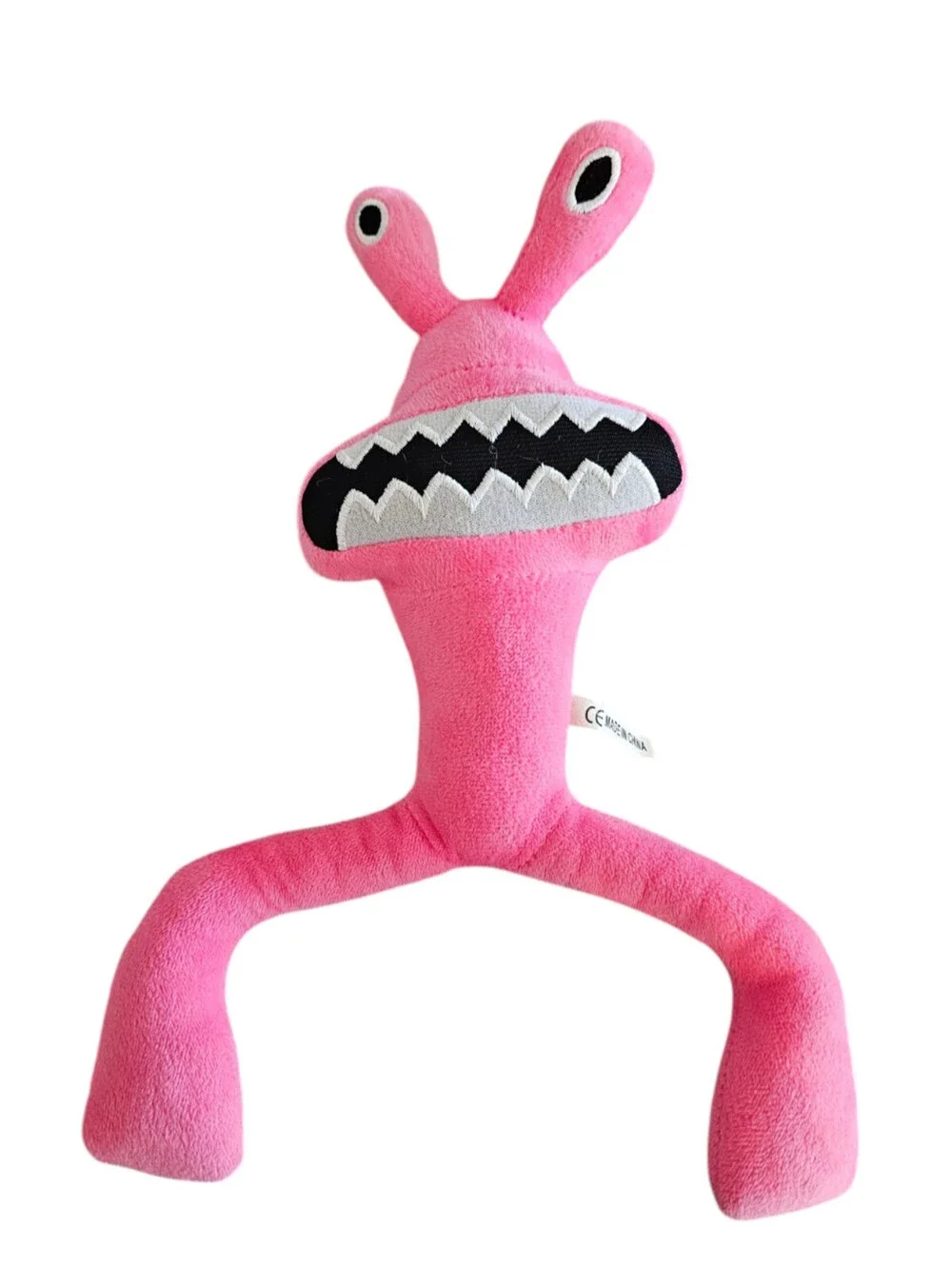 Rainbow Friends plush toy is a bright pink character
